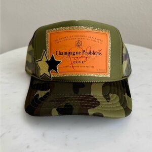 Camo Trucker Hat with Orange 'Champagne Problems' Detail